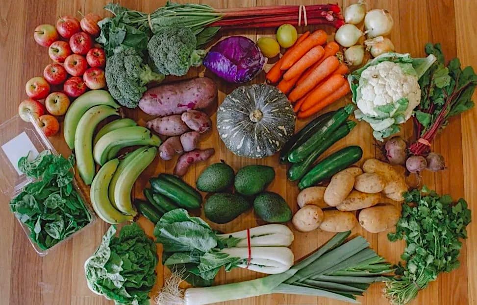 A Farmacy Organics fruit & veg box packed with fresh produce